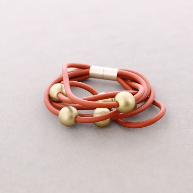 PULSERA 6 TIRAS CAUCHO BOLAS