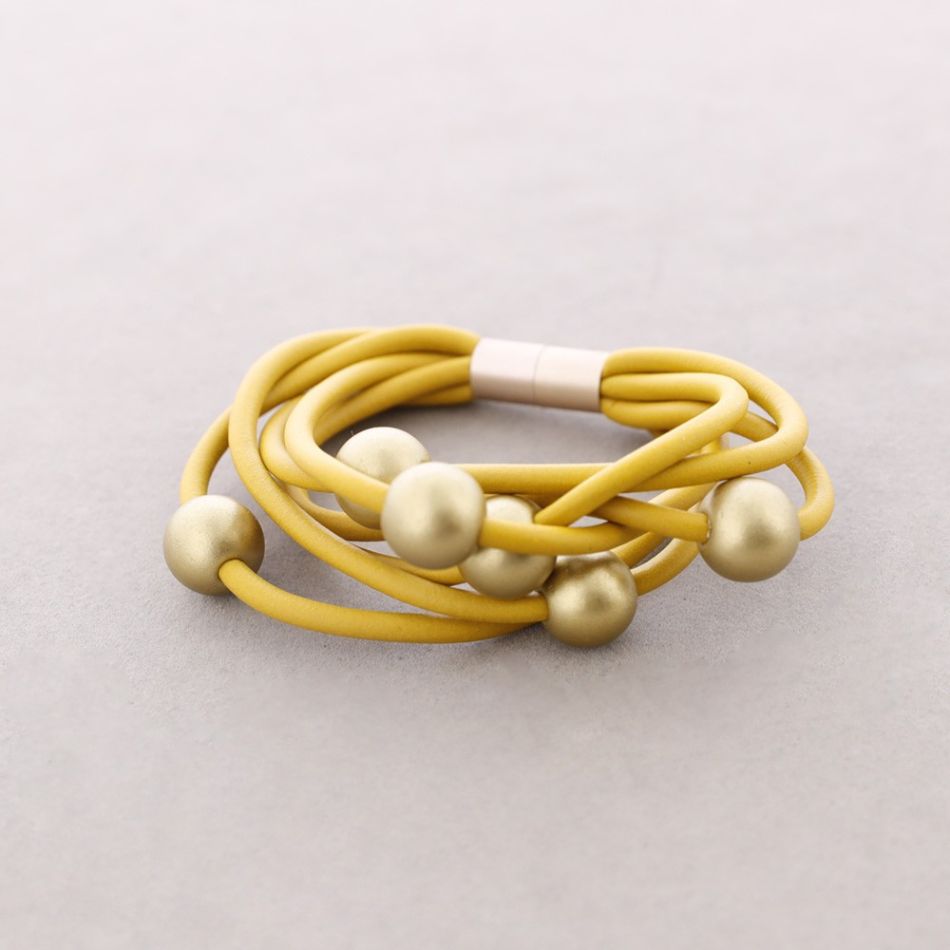 PULSERA 6 TIRAS CAUCHO BOLAS