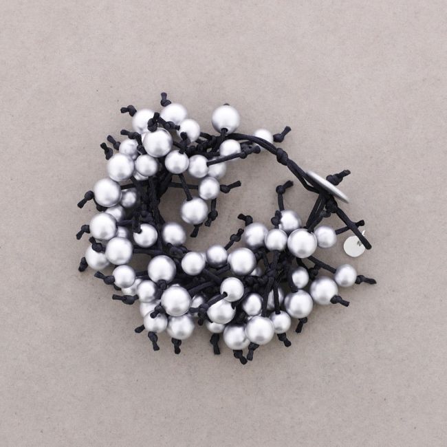 FRINGE BRACELET WITH METAL FINISH BALLS