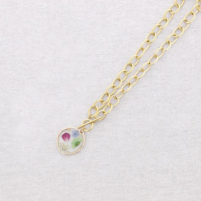 STEEL NECKLACE WITH DRIED FLOWER PENDANT