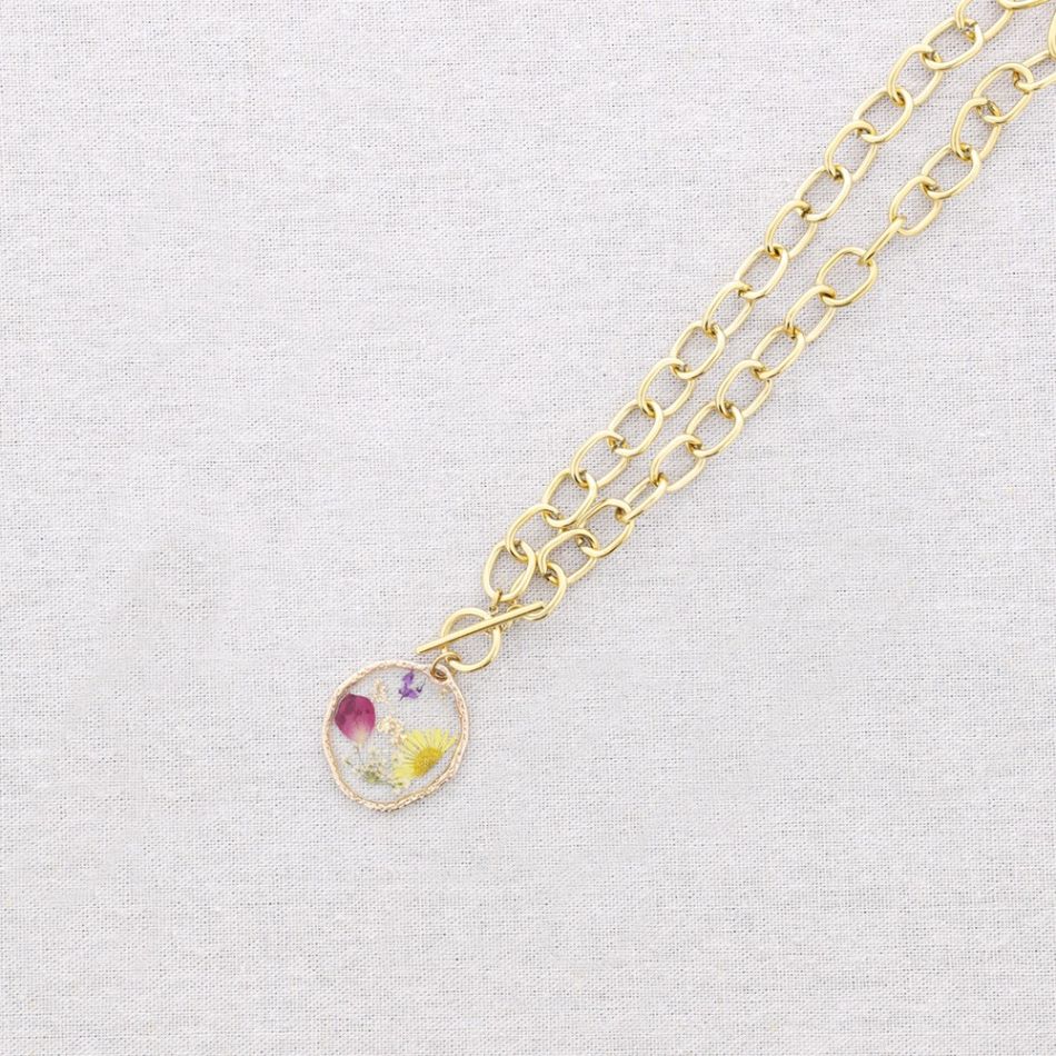 STEEL NECKLACE WITH DRIED FLOWER PENDANT