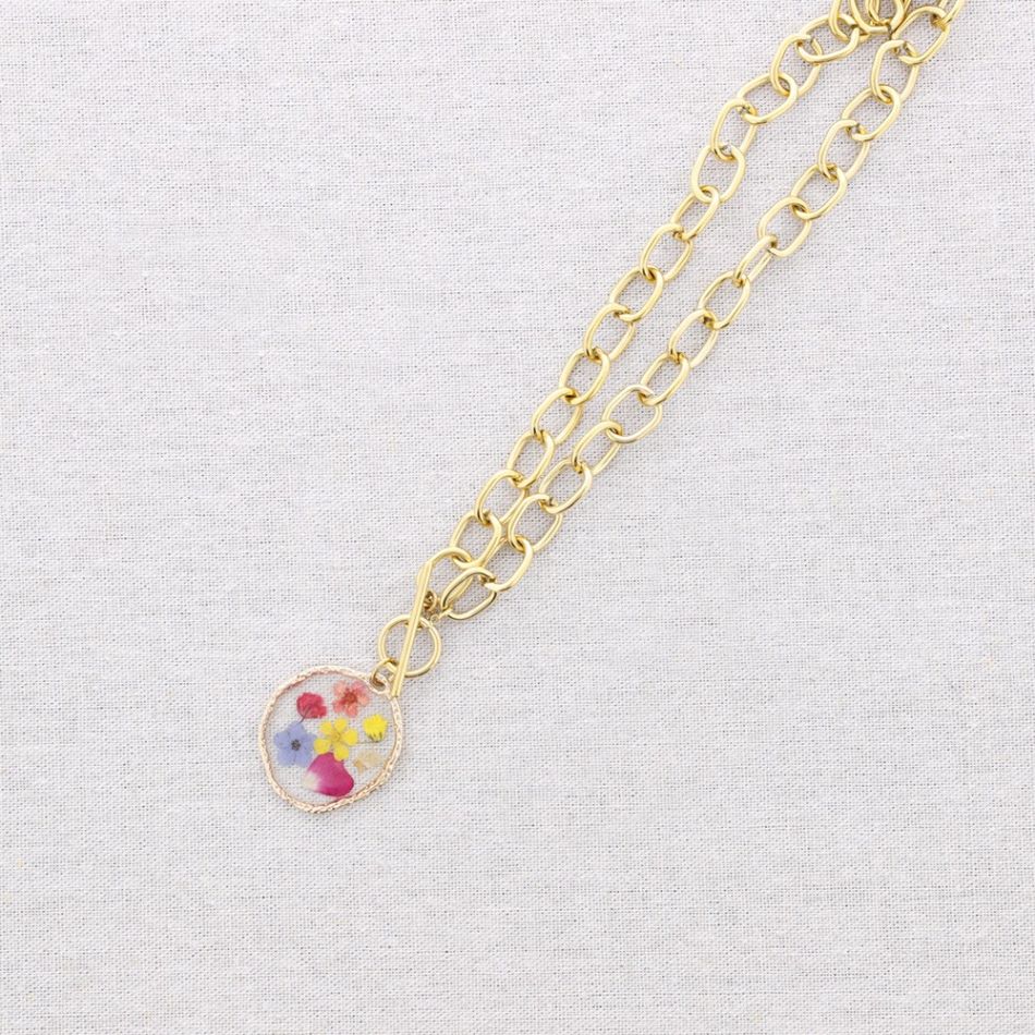 STEEL NECKLACE WITH DRIED FLOWER PENDANT