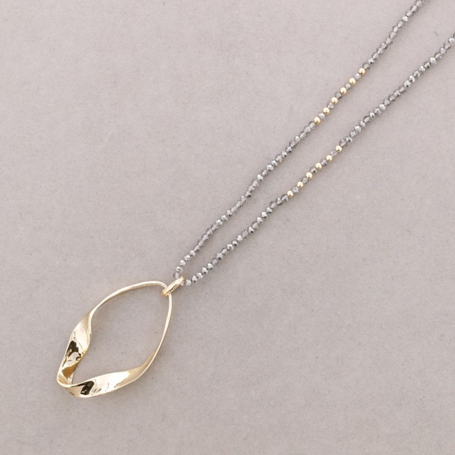 LONG NECKLACE WITH FACETED CRYSTALS AND IRREGULAR RING PENDANT