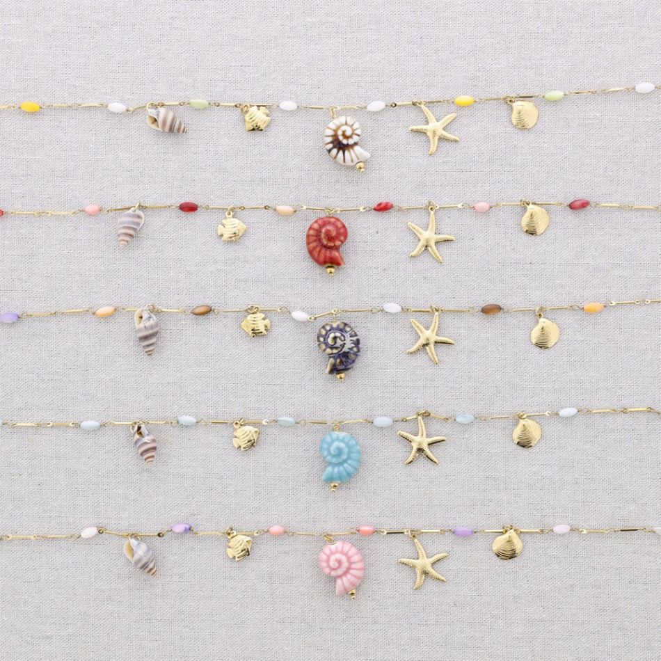 STEEL NECKLACE WITH MARINE MOTIF PENDANTS