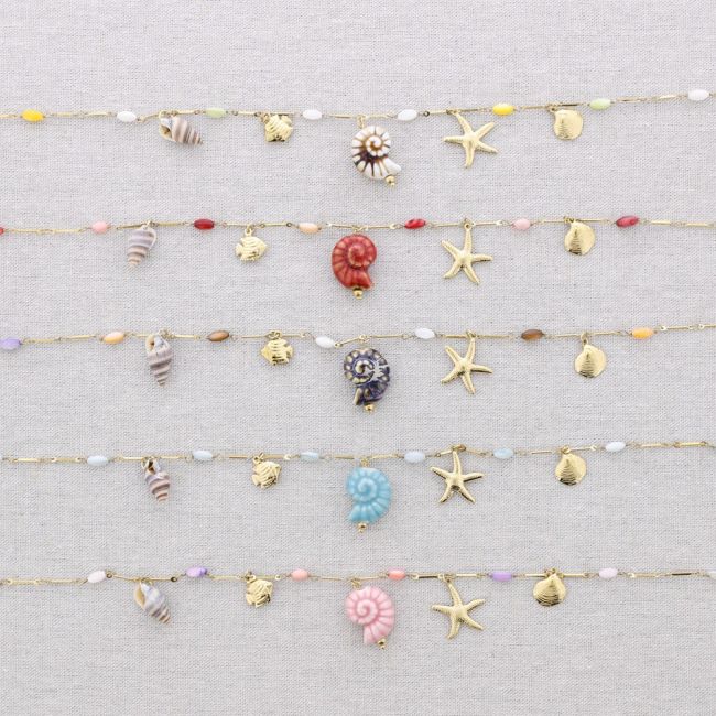 STEEL NECKLACE WITH MARINE MOTIF PENDANTS
