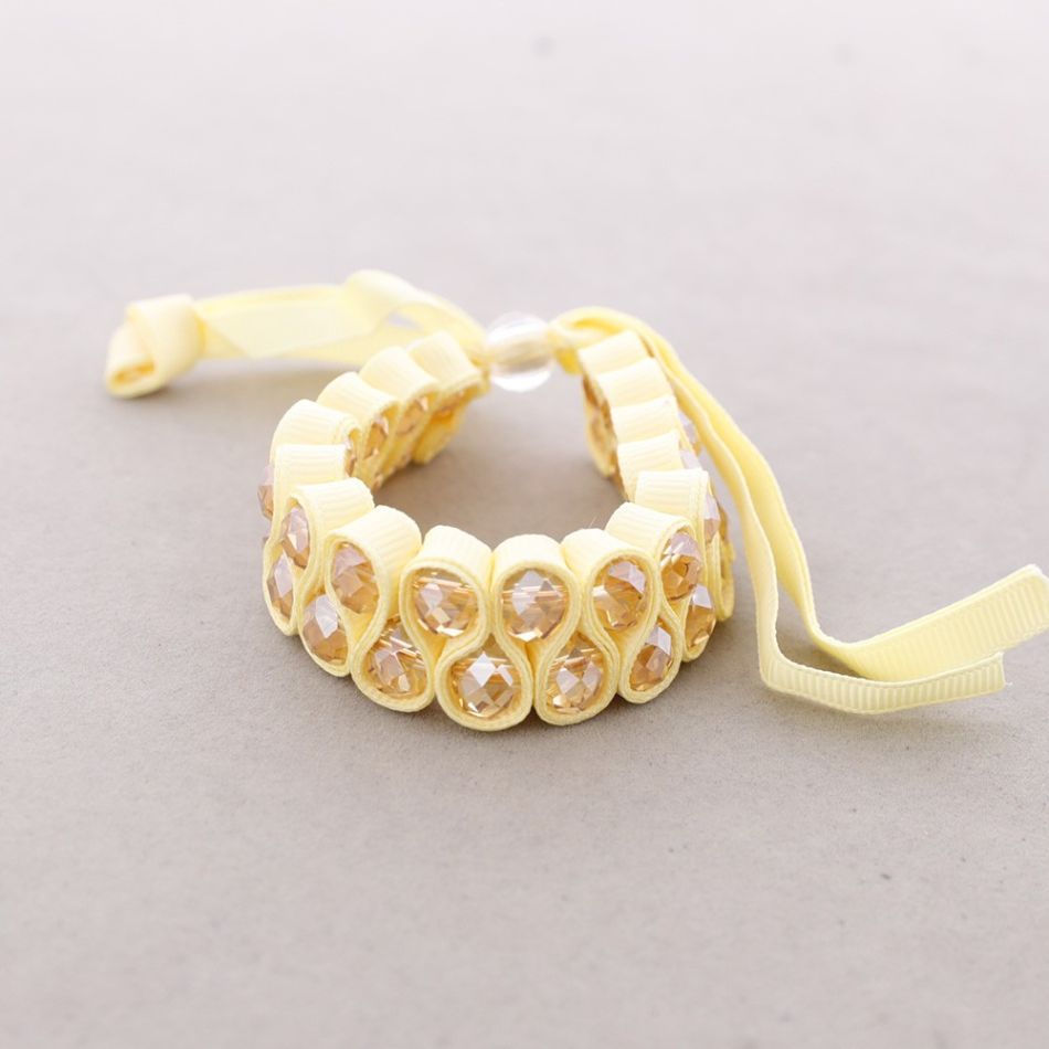 BOW BRACELET WITH FACETED BEADS
