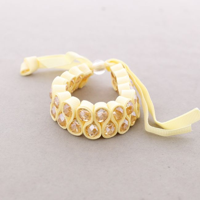 BOW BRACELET WITH FACETED BEADS