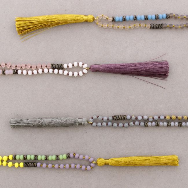 LONG NECKLACE WITH FACETED BEADS AND FRINGE PENDANT