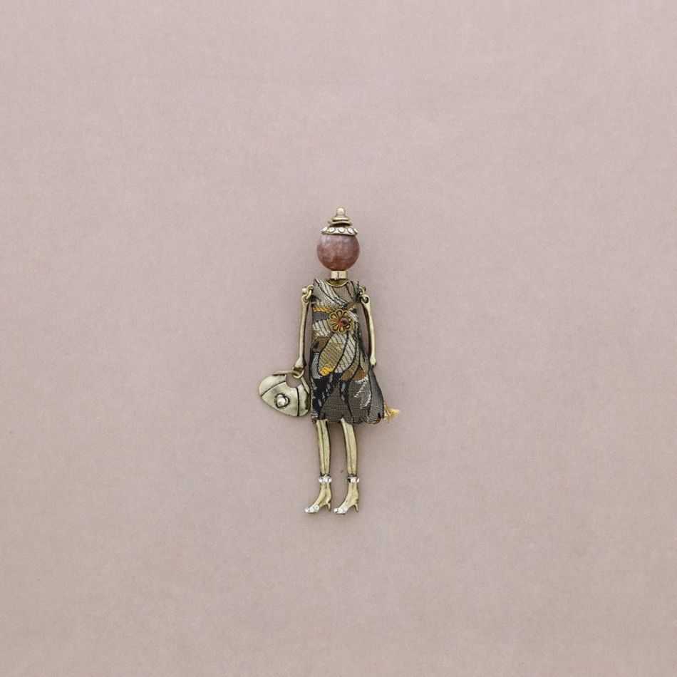 BROCHE METAL MUÑECA