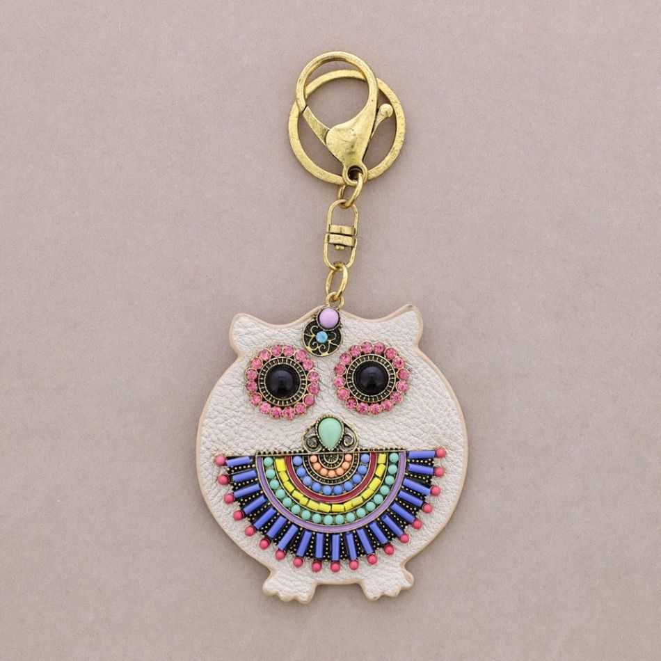 IMI FIGURE KEYCHAIN. LEATHER BEADS