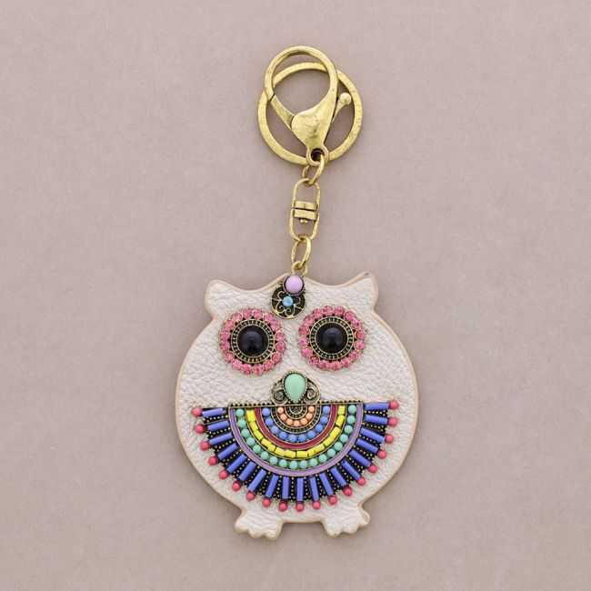 IMI FIGURE KEYCHAIN. LEATHER BEADS