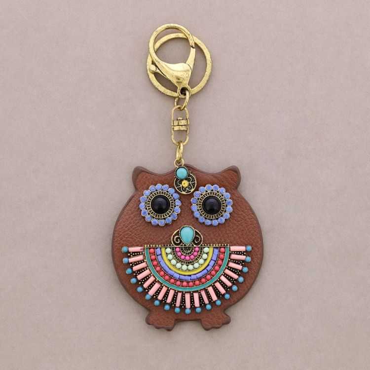 IMI FIGURE KEYCHAIN. LEATHER BEADS