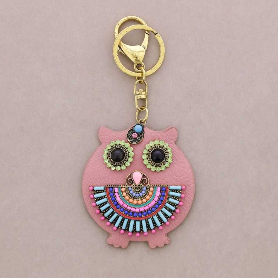 IMI FIGURE KEYCHAIN. LEATHER BEADS