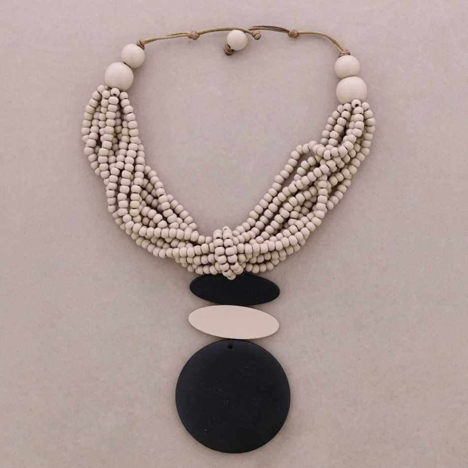 MULTI-WRAPPED CHOKER WITH WOODEN MEDAL PENDANTS
