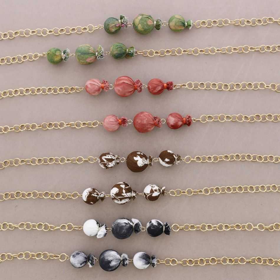 LONG METAL NECKLACE WITH FABRIC-COVERED BEADS
