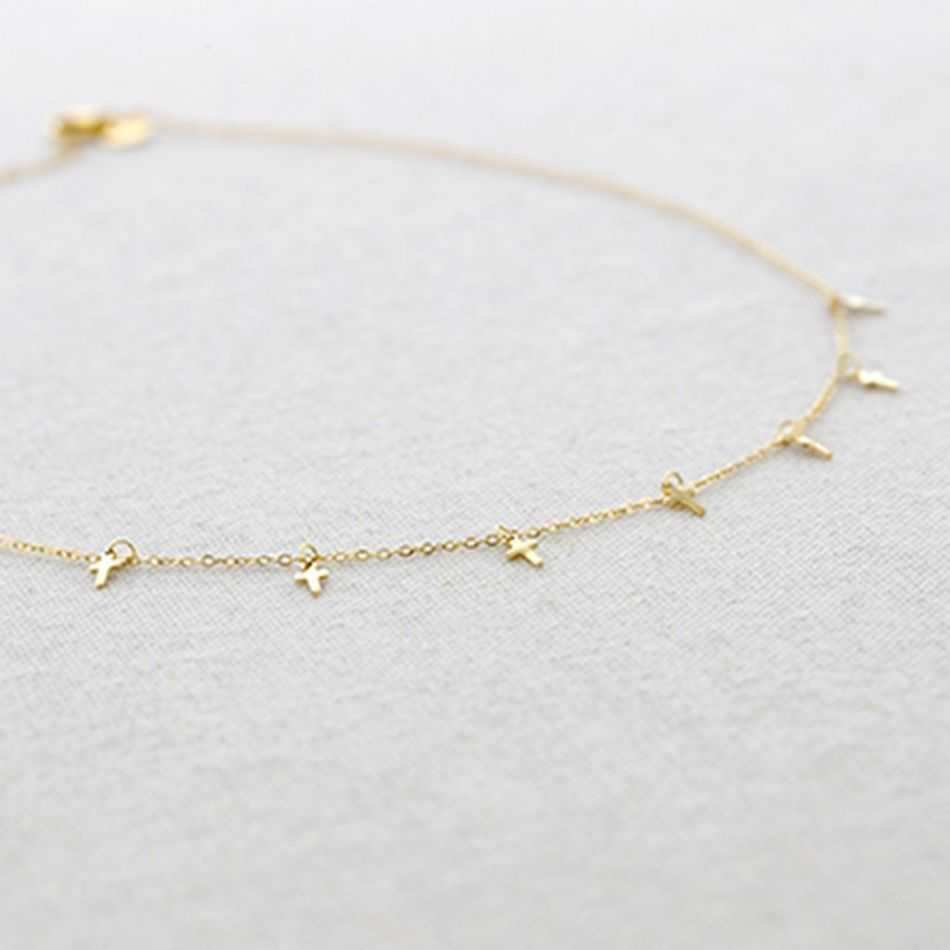 STEEL SHORT NECKLACE WITH LITTLE CROSS PENDANTS