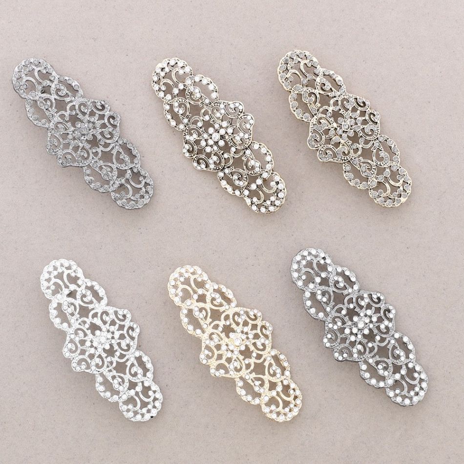 METAL CRYSTAL SADDLE BROOCH