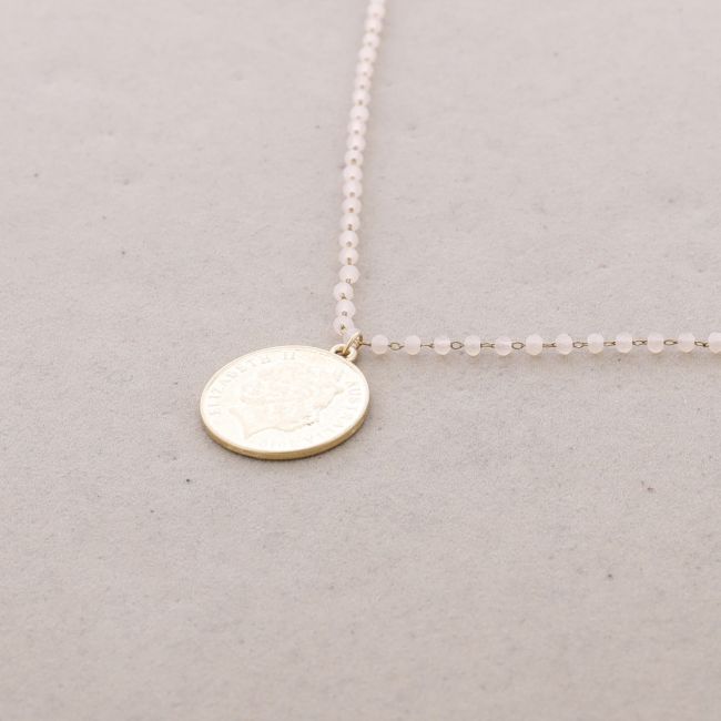 LONG NECKLACE WITH FACETED CRYSTALS AND METAL COIN PENDANT
