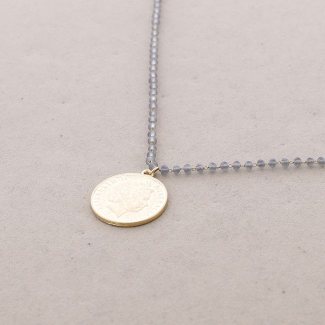 LONG NECKLACE WITH FACETED CRYSTALS AND METAL COIN PENDANT