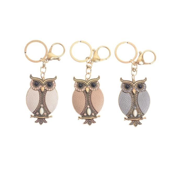 IMI FIGURE KEYCHAIN. LEATHER BEADS