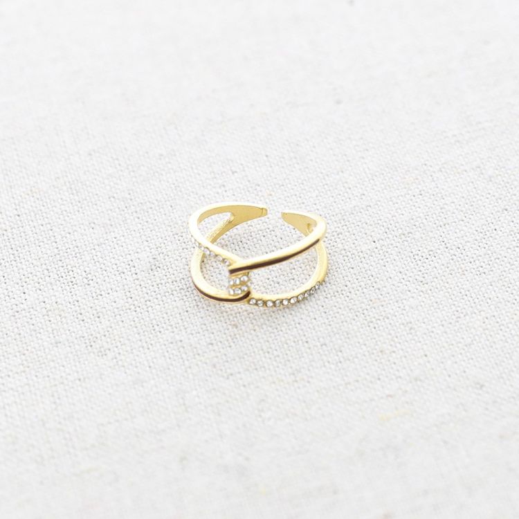STEEL CROSSED CRYSTALS RING