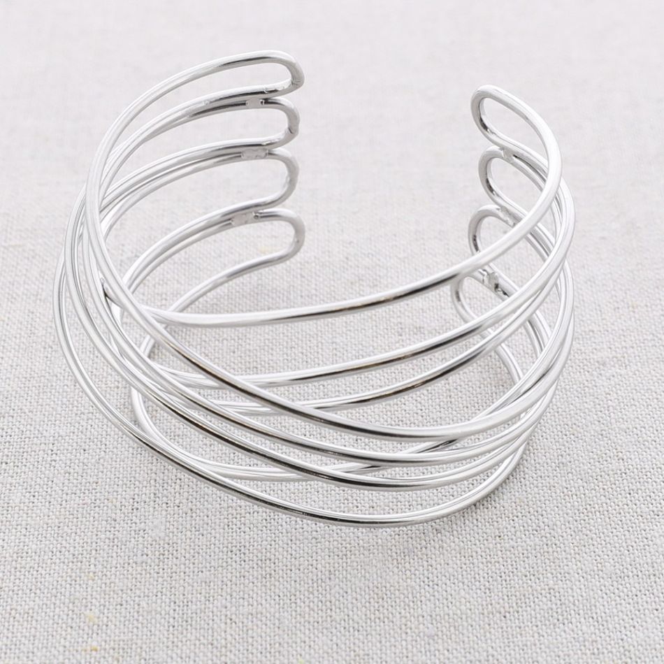 ADJUSTABLE CROSSED STEEL BRACELET