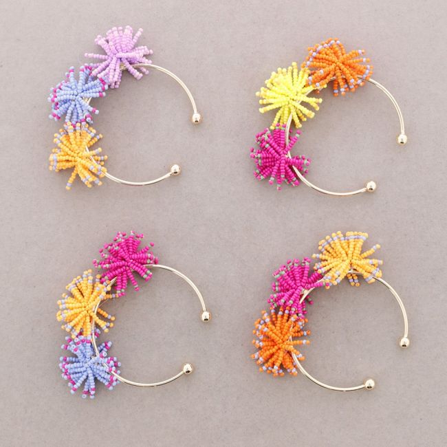 RIGID BRACELET WITH POMPOMS AND BEADS